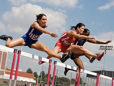 Awe Video Sports Video Editing & Production home page icon image of thre girl hurdlers.