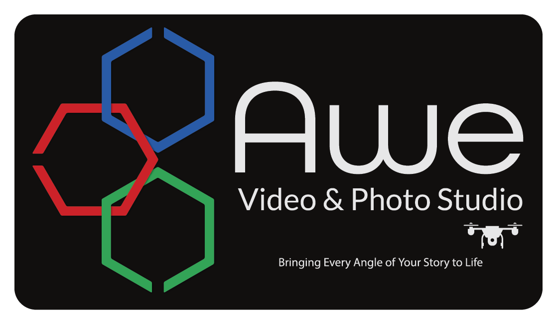 AVPS Logo white print w-drone-slogan 8-16-25 Awe Video & Photo Studio logo with drone image.
