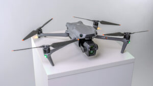 Product Image of the DJI Air 3S drone on pedestal with its navigation lights on. Part of the Awe Video & Photo Studio drone fleet. (Photo by Awe Video & Photo Studio) Professional product image of the DJI Air 3S drone on pedestal with navigation light on, part of the Awe Video & Photo Studio drone fleet. (Photo by Awe Video & Photo Studio)